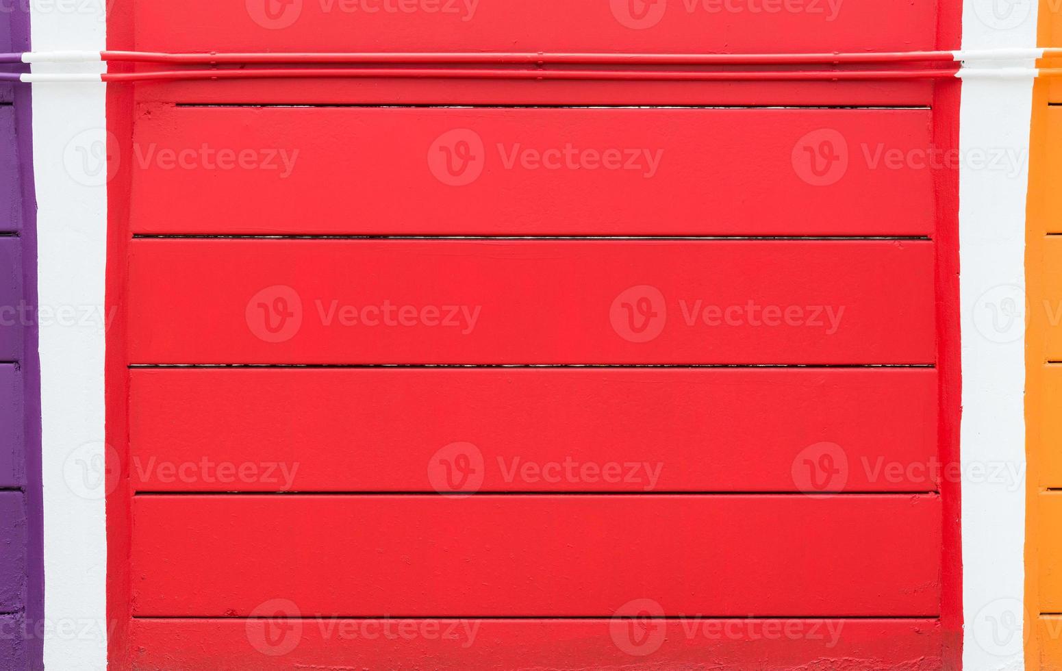 Colorful cement wall with cable tube photo