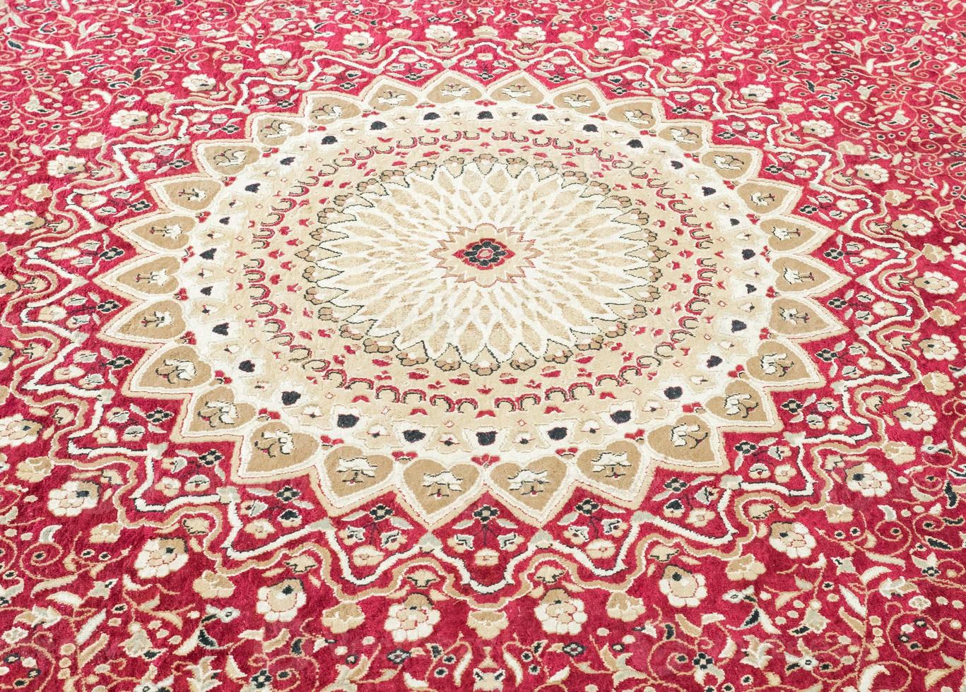 Floral pattern on the wool carpet. photo