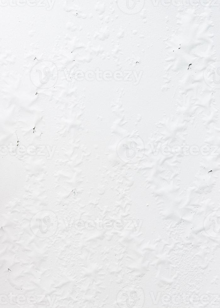 Peeling white walls from the rain season. photo