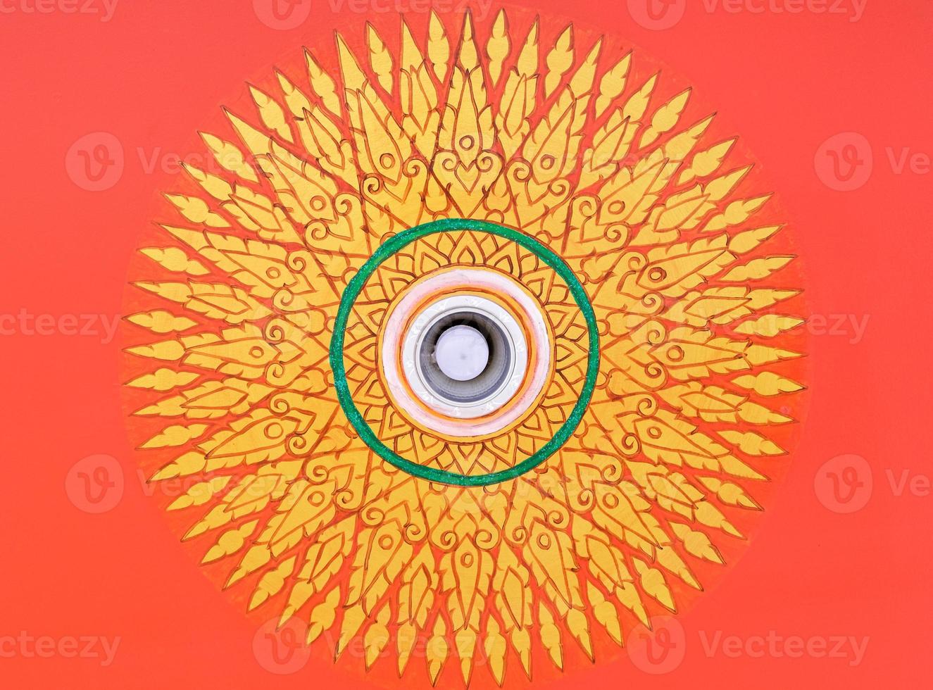 Circle pattern in the traditional Thai style around the led bulb. photo