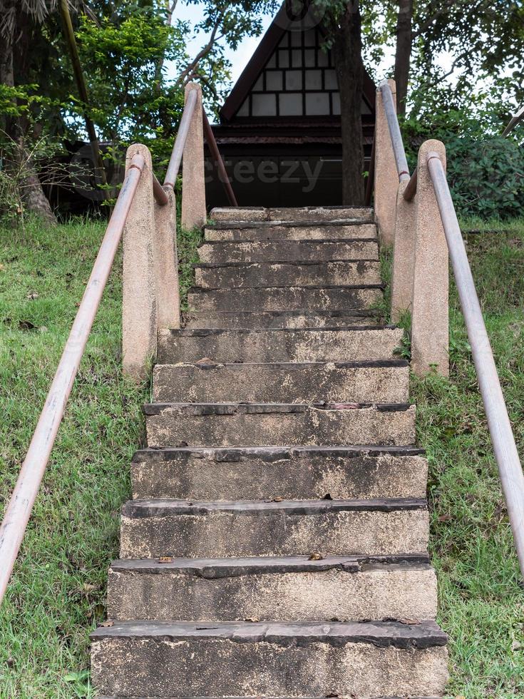 Old staircase with metal rail. photo