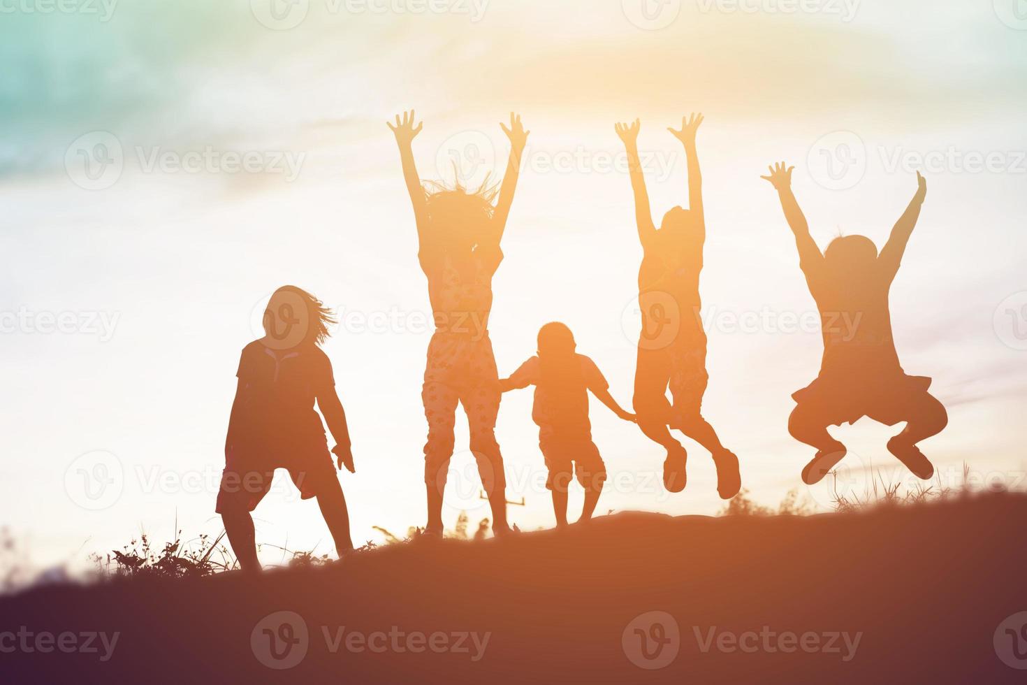 silhouette of a happy children and happy time sunset photo
