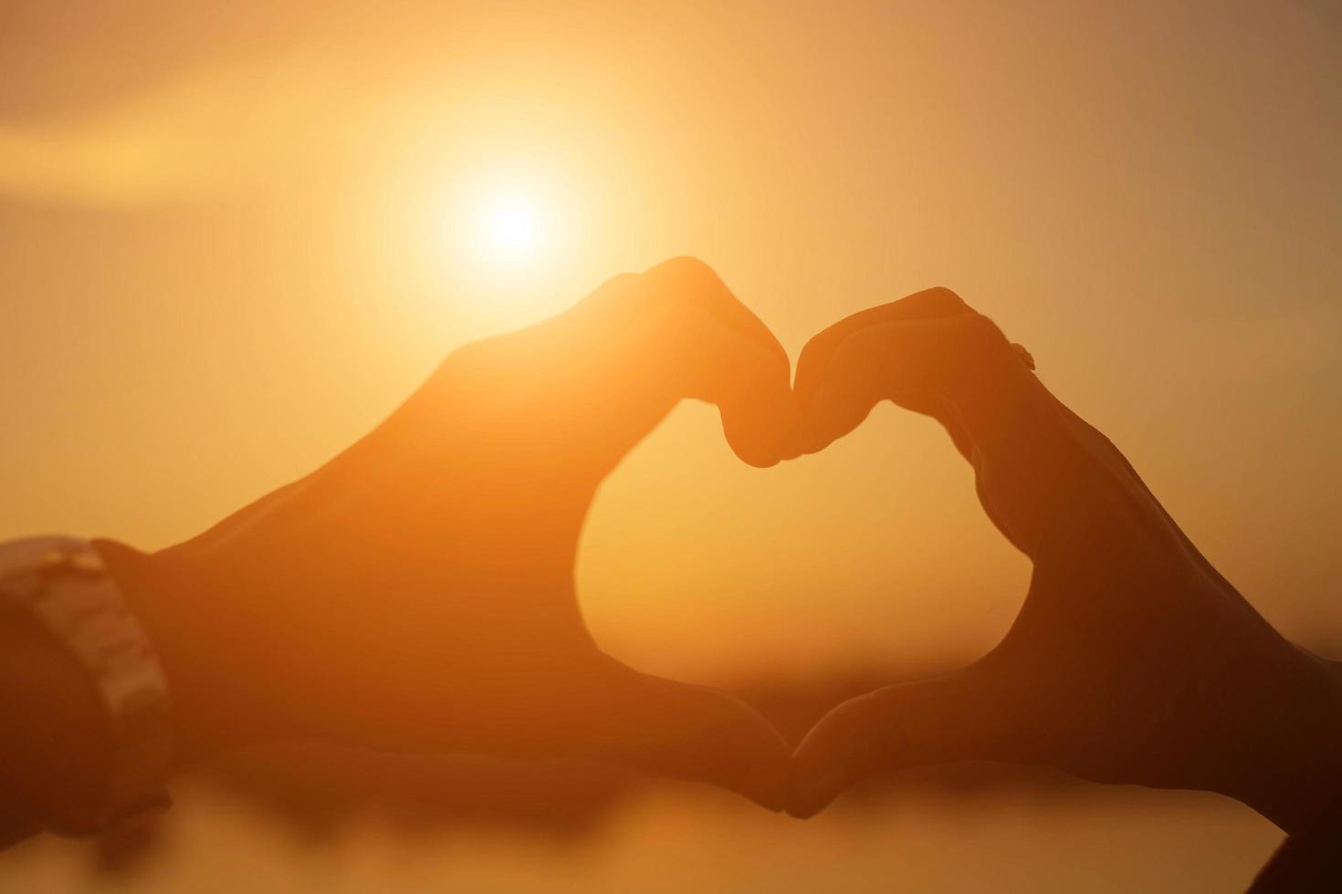 hands in shape of love heart photo