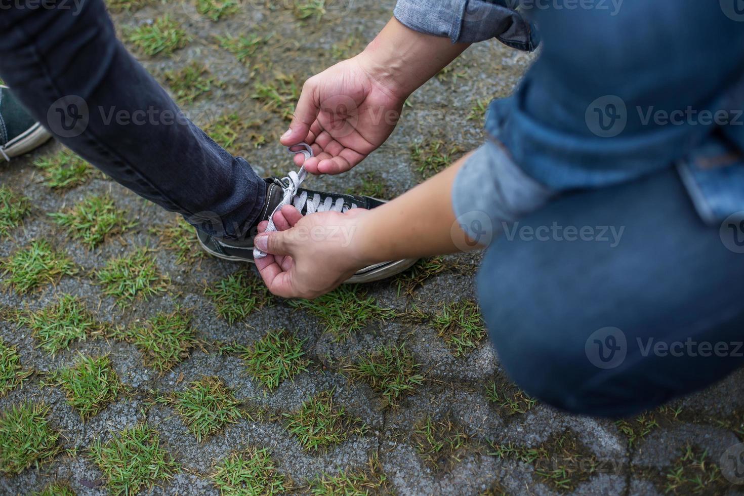 Walking women jeans and shoes with sun light photo