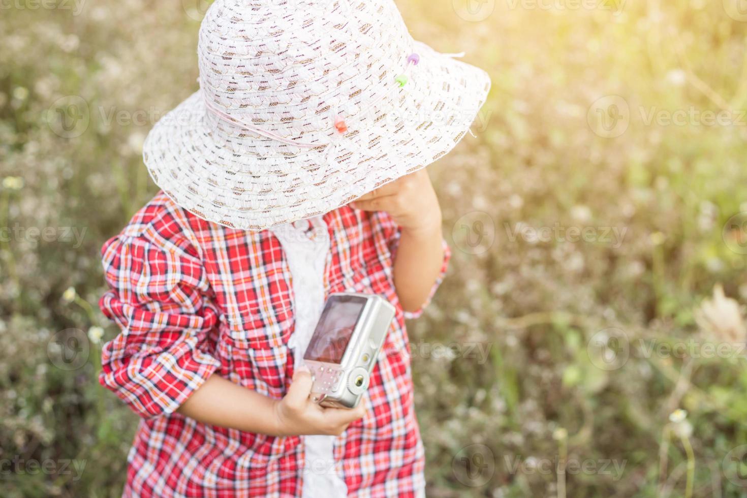 little girl photographs flower outdoor photo