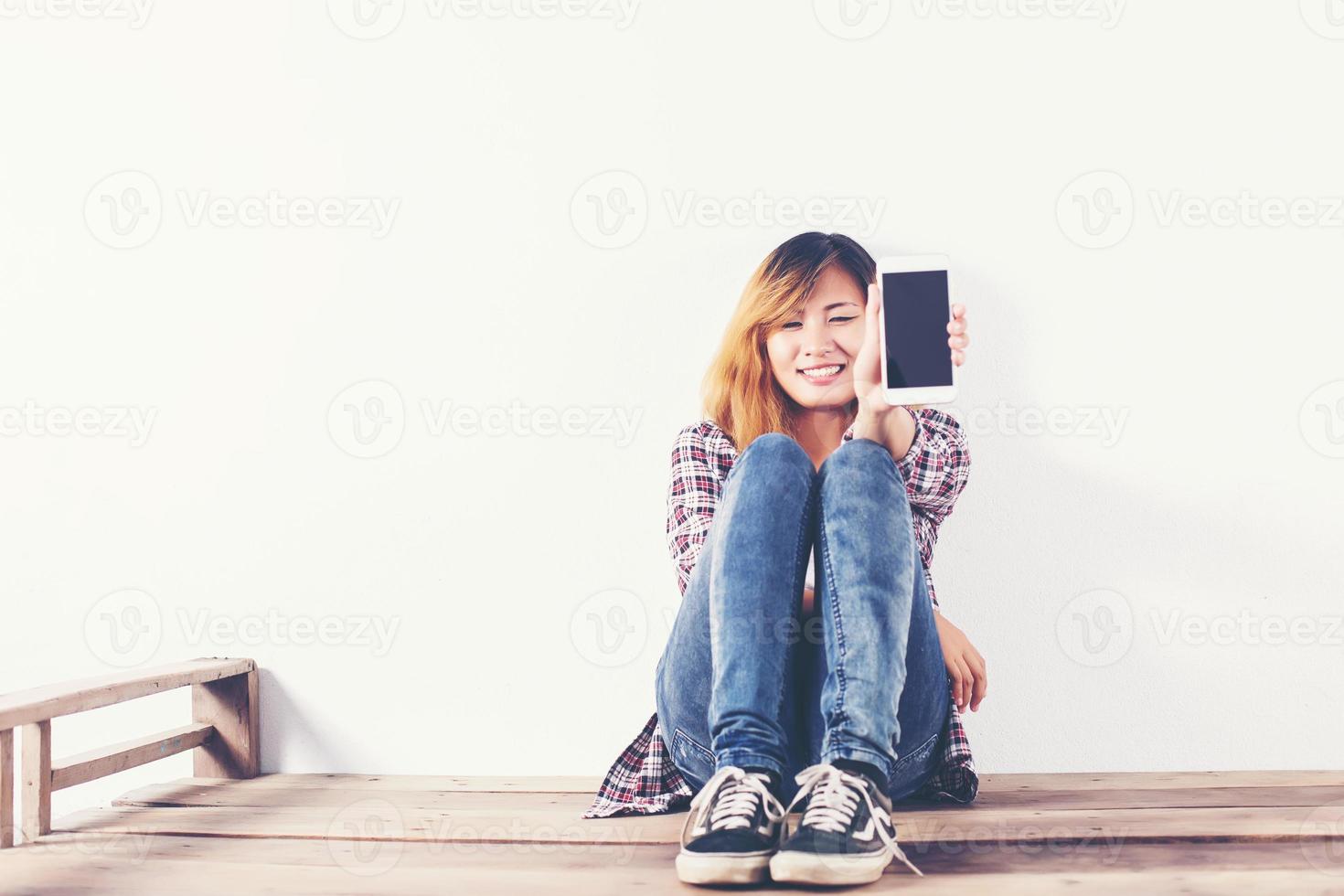 Close-up of a woman typing on mobile phone isolated on white background,Woman's hand holding smartphone. photo