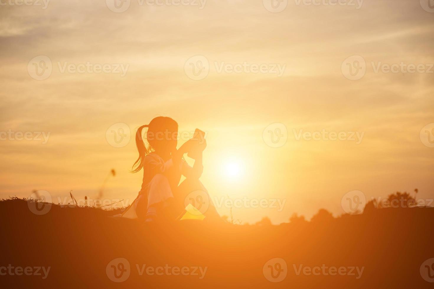 kid silhouette,Moments of the child's joy. On the Nature sunset photo