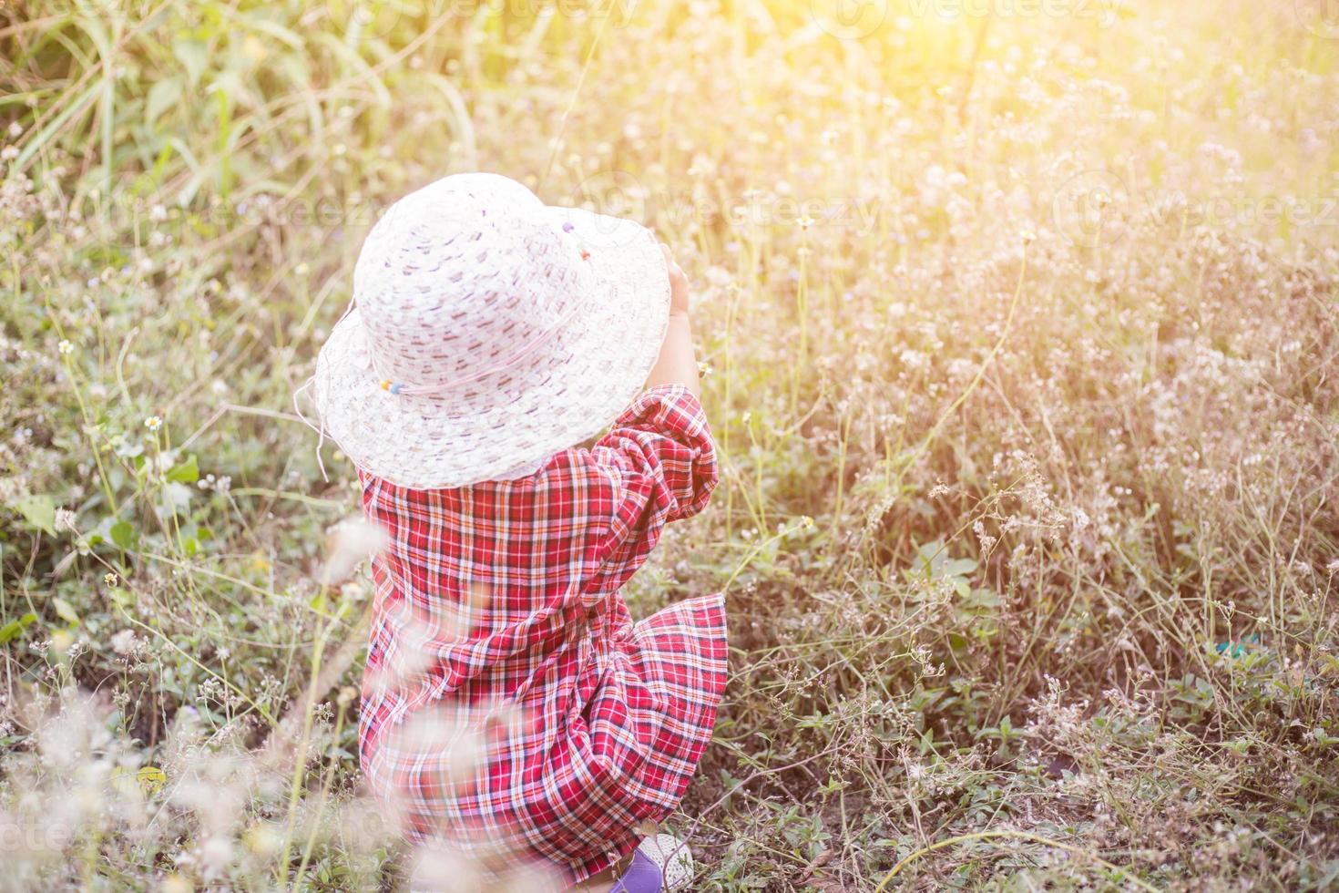 little girl photographs flower outdoor photo