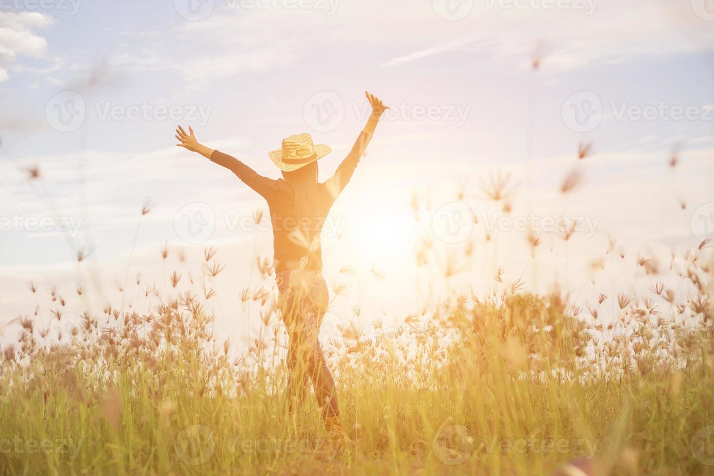 Silhouette of woman praying over beautiful sky background photo
