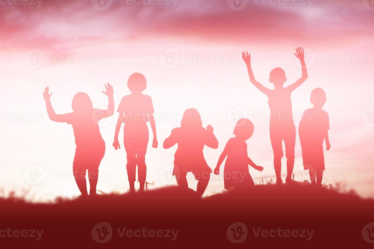 silhouette of a happy children and happy time sunset photo