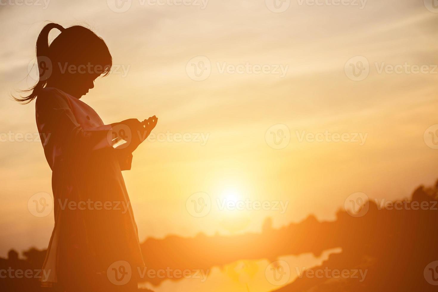 kid silhouette,Moments of the child's joy. On the Nature sunset photo