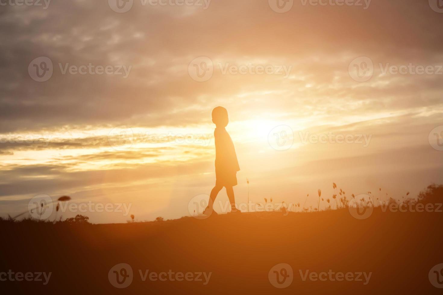 kid silhouette,Moments of the child's joy. On the Nature sunset photo