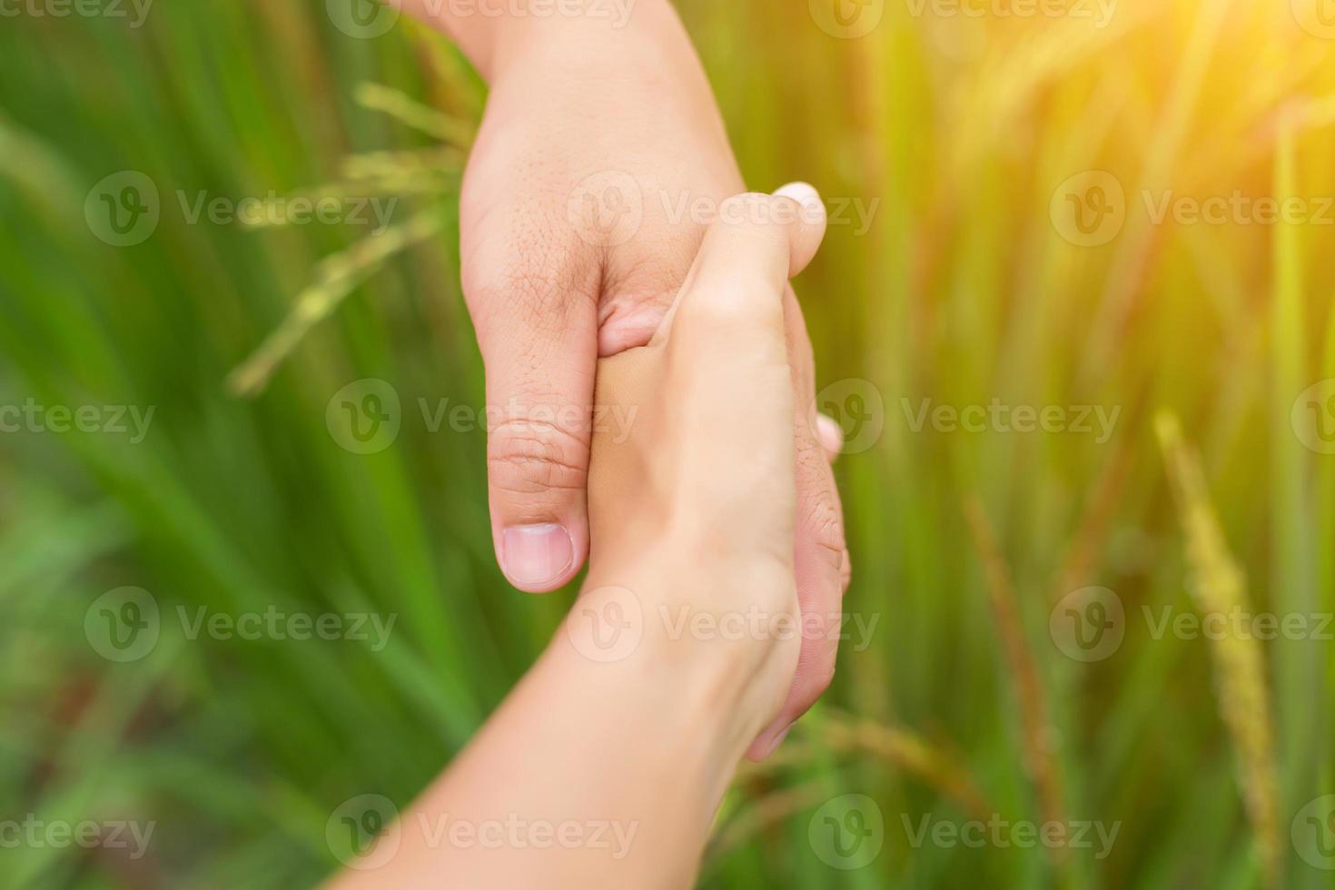 Hand of Young Woman Enjoying Nature with sunrise. photo