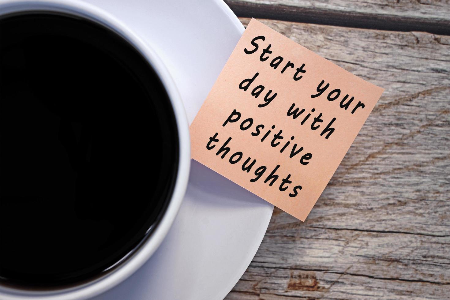 Motivational and inspirational quote on notes with coffee cup photo