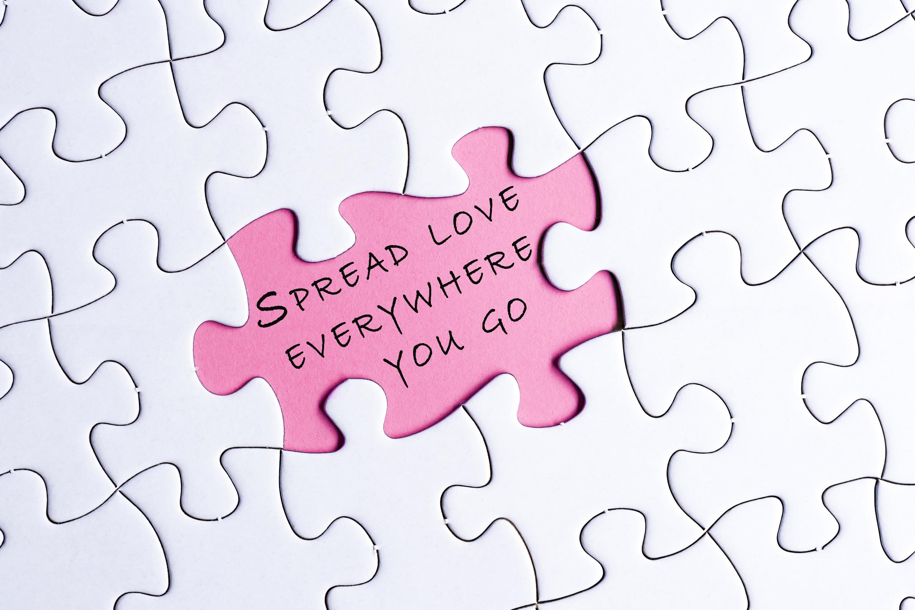 White jigsaw puzzle with motivational and inspirational quote over