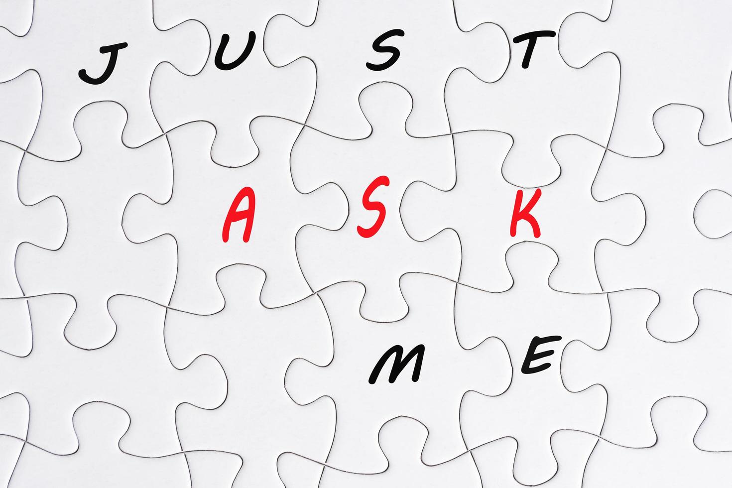 Just ask me text on puzzle pieces. Question and ask concept. photo