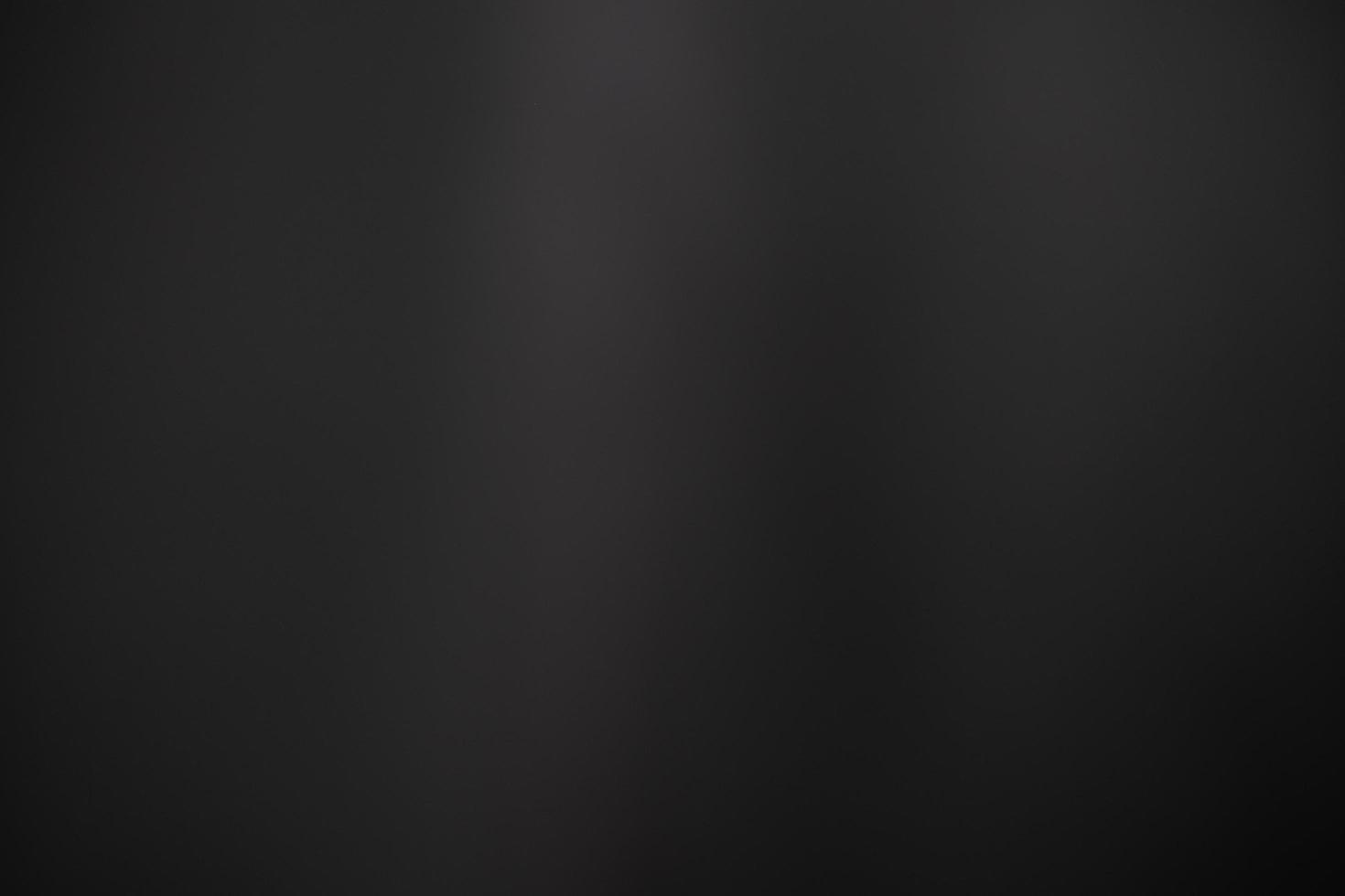 Dark black and gray blurred background has a little abstract light. soft background for wallpaper,design,graphic and presentation photo