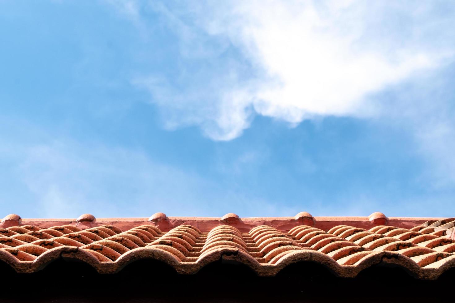 red roof and blue sky background photo