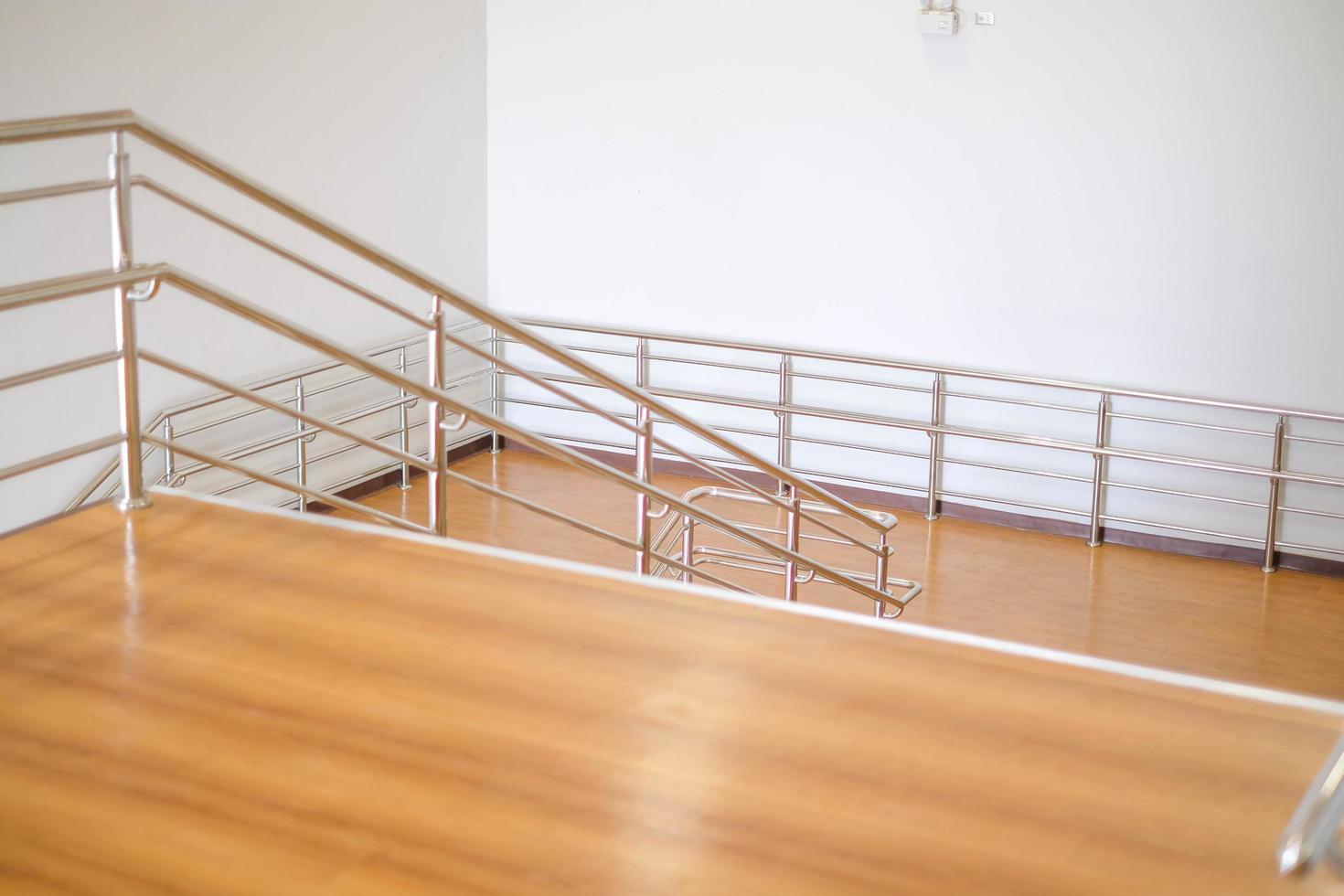 Modern brown staircase, walkway up the building building, aluminum steel railing photo