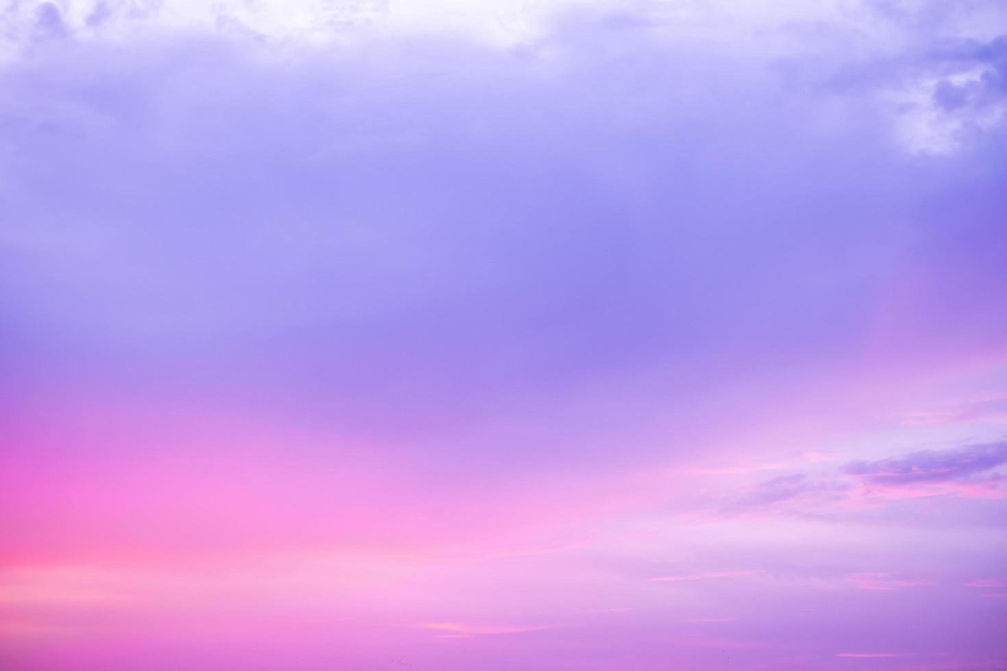 beautiful soft orange clouds  and sunlight on the blue sky perfect for the background, take in morning,Twilight, sky  gradient background,purple sky photo