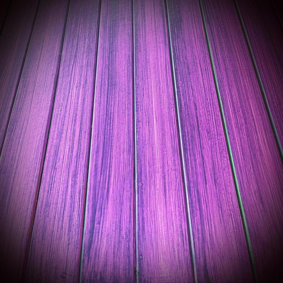 Background of purple wood pattern texture of the wall. photo