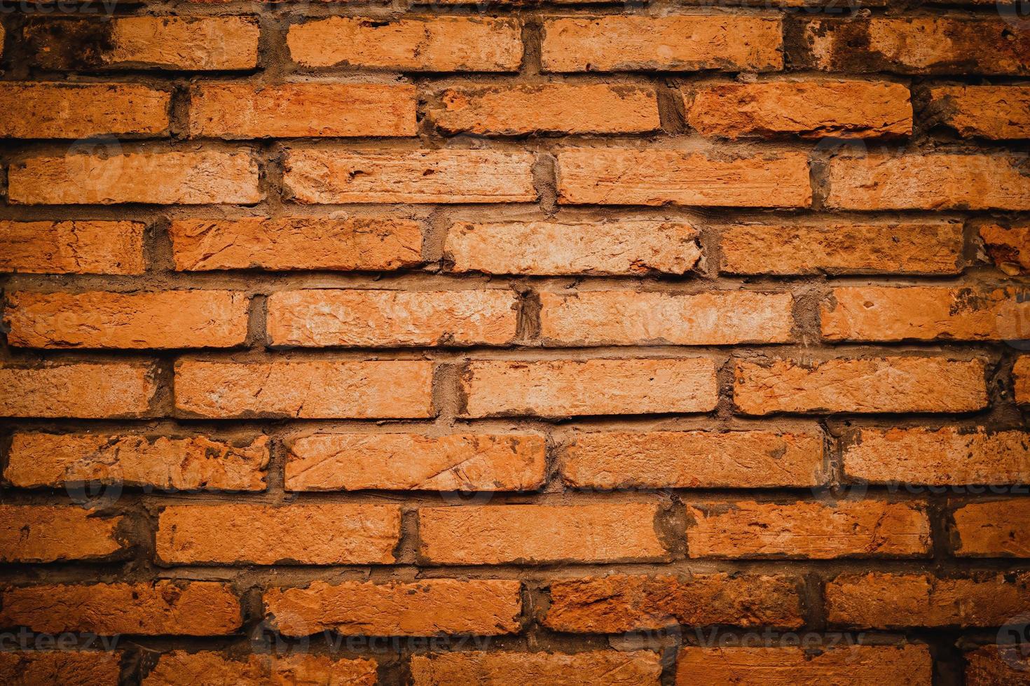 Red brick wall. Texture of old brown and red brick wall background. Fragment of red brick wall closeup. The structure of the background. Template for an inscription. Mockup for designs. photo