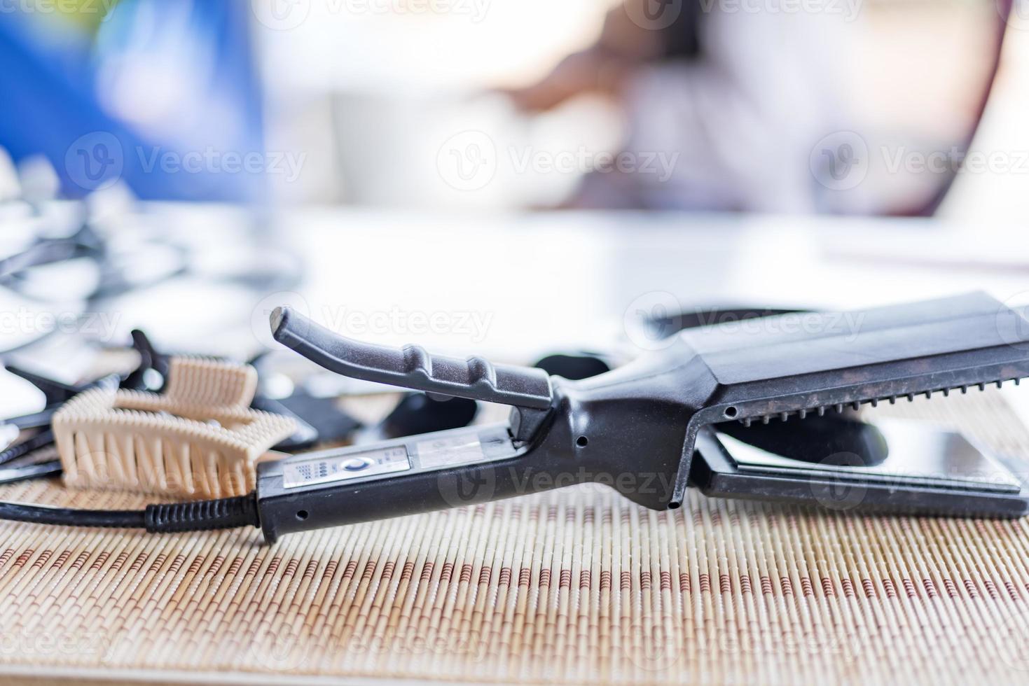 Close-up of hairdressing tools on a wooden table. photo