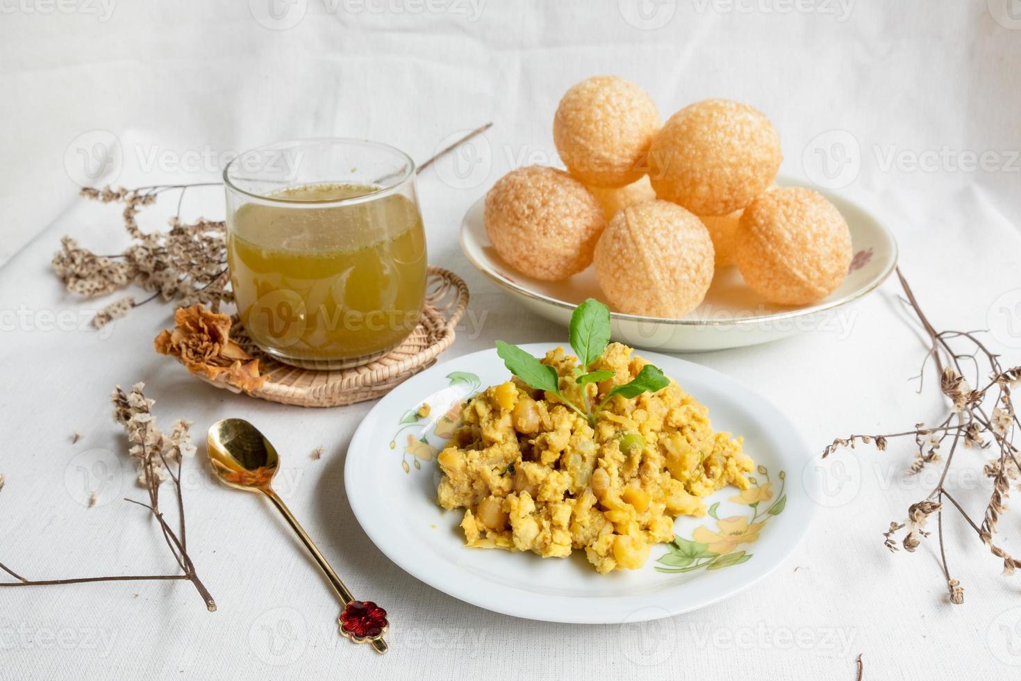 Homemade pani puri, Golgappa Indian snack on cotton calico background photo