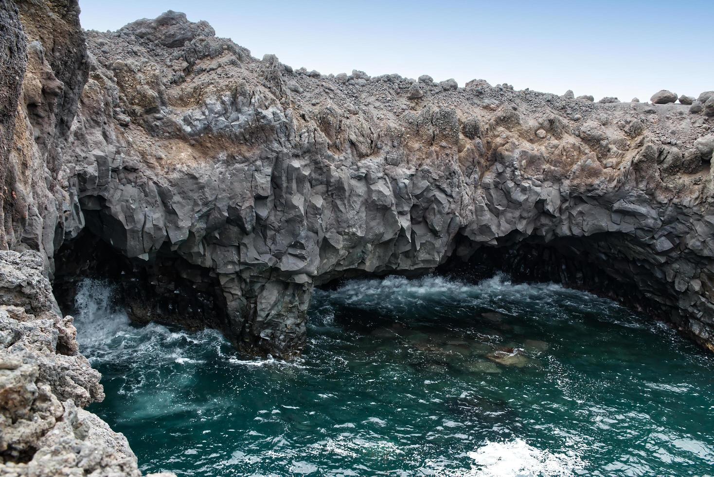 View of the vast lava fields and boiling waters of Los Hervideros, Lanzarote, Canary Islands, Spain. photo