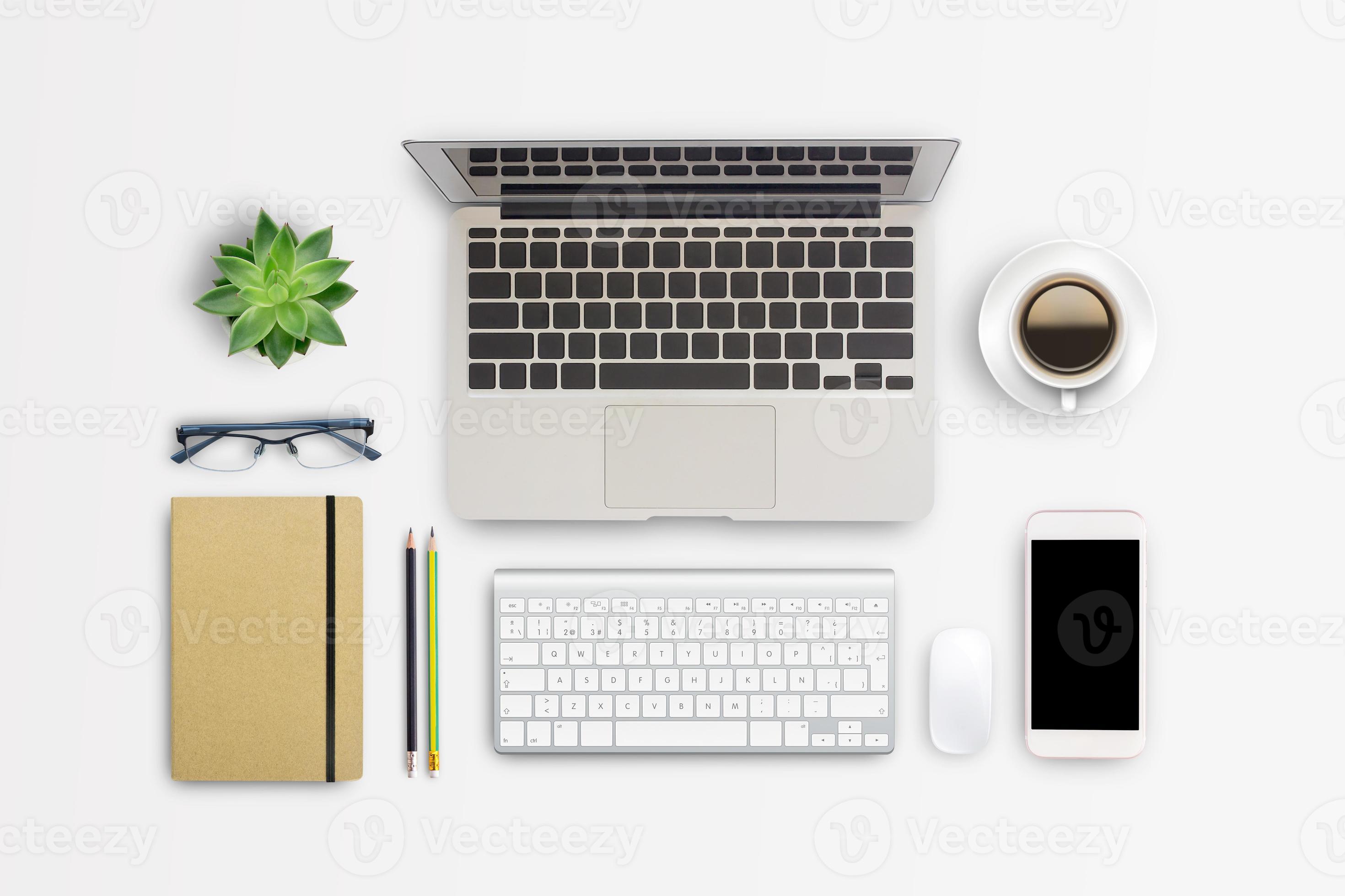 Top view modern workspace with coffee cup and laptop computer,notebook,glasses,smartphone on