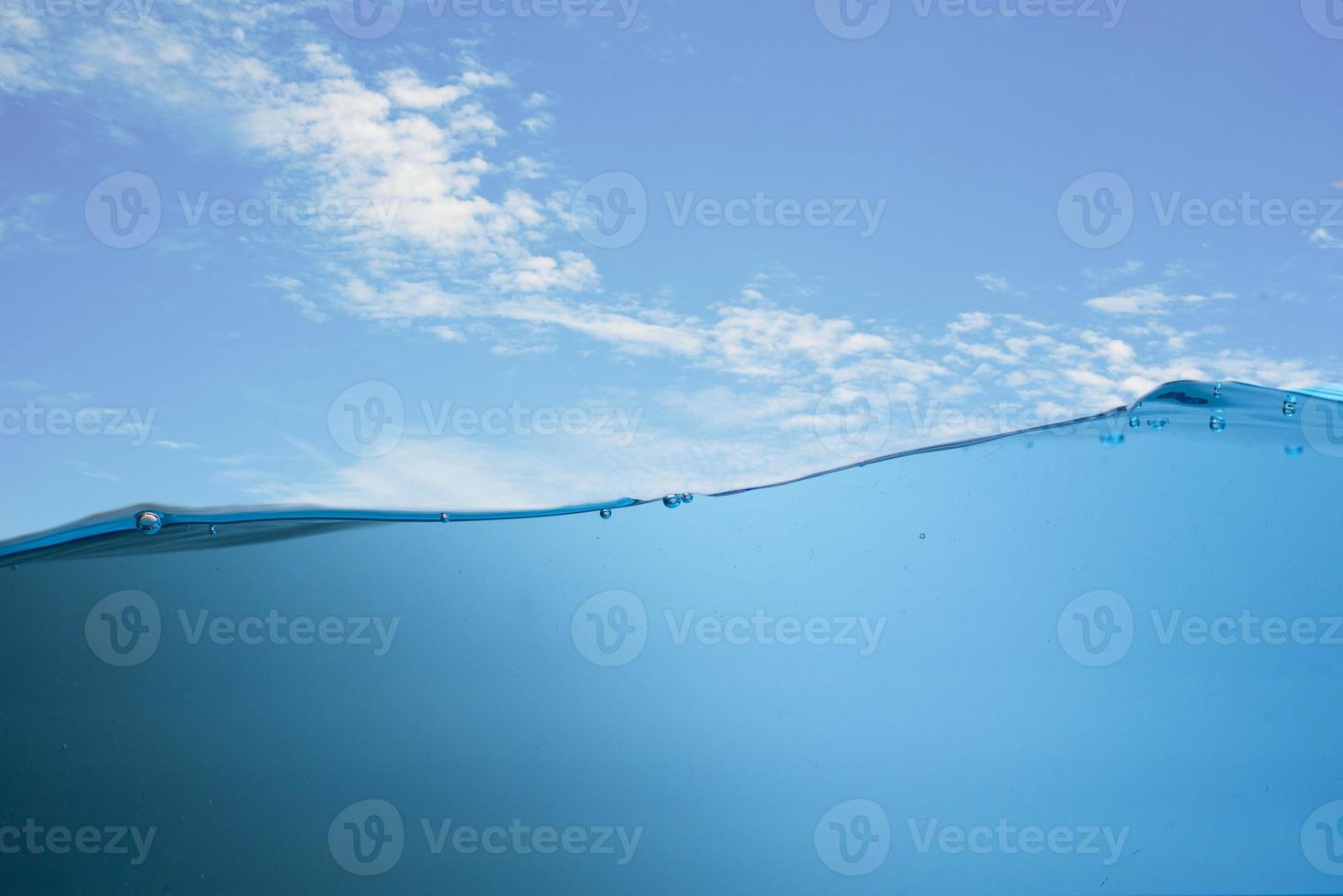 Spectacular ocean waves stop steaming with separate bubbles on a bright sky background. Popular corners, natural concepts photo