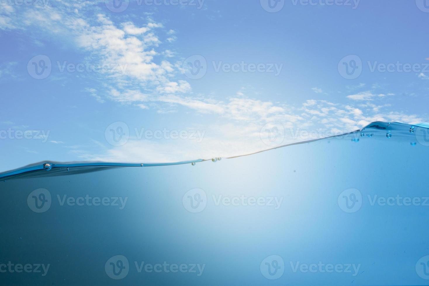 Spectacular ocean waves stop steaming with separate bubbles on a bright sky background. Popular corners, natural concepts photo
