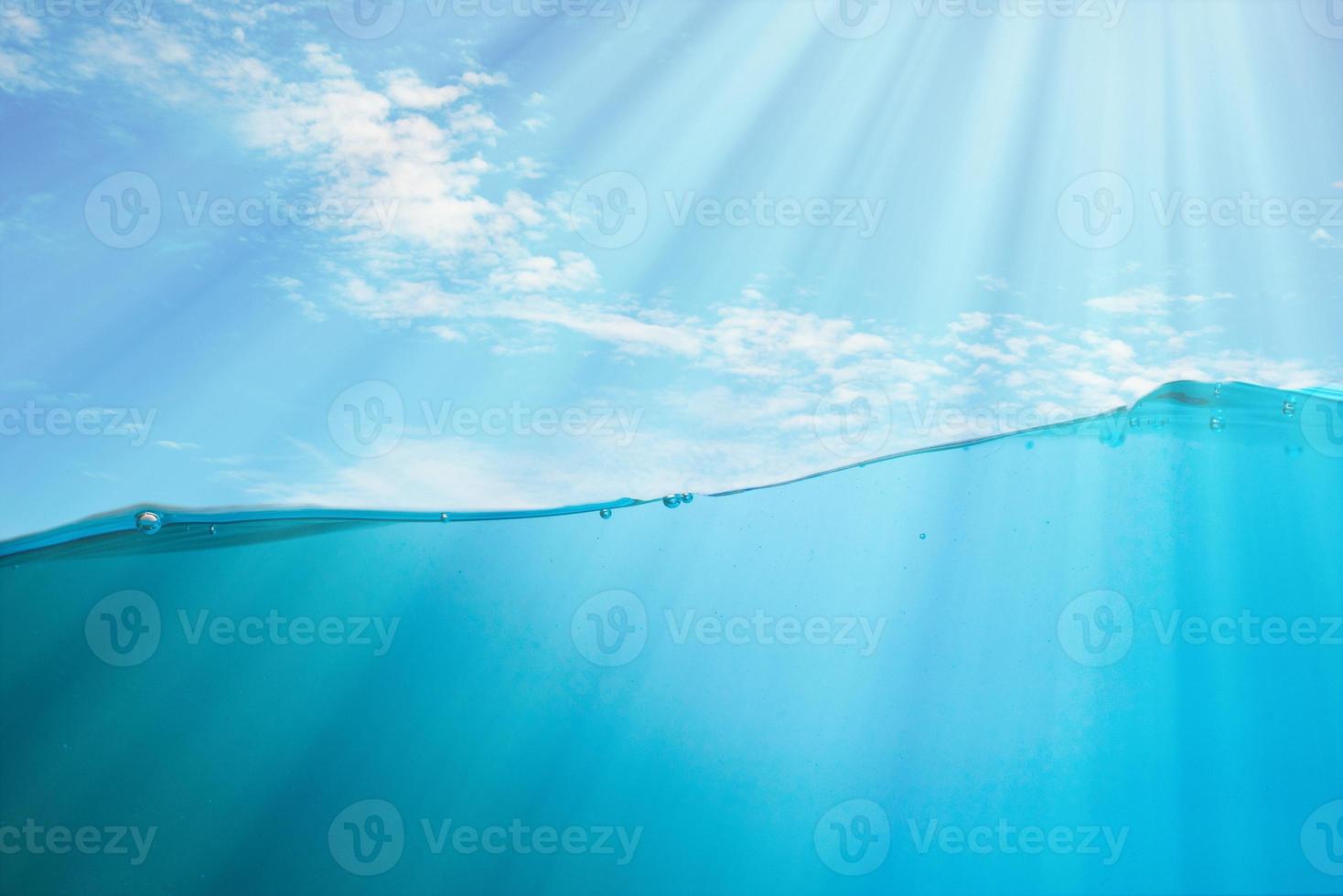 Spectacular ocean waves stop steaming with separate bubbles on a bright sky background. Popular corners, natural concepts photo