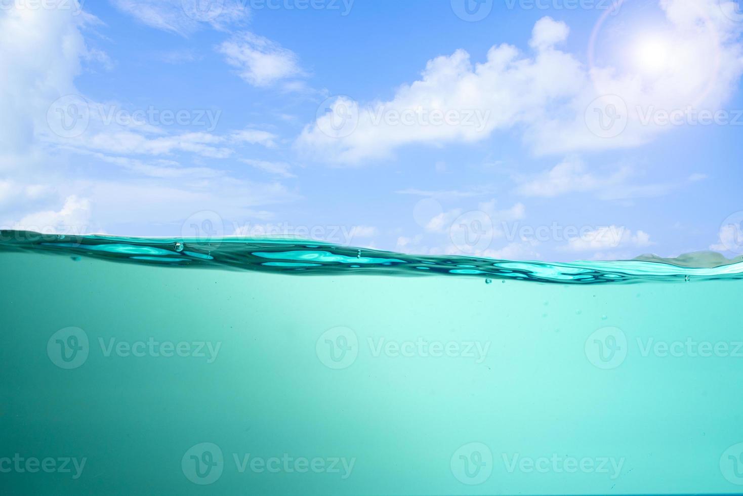 Spectacular ocean waves stop steaming with separate bubbles on a bright sky background. Popular corners, natural concepts photo