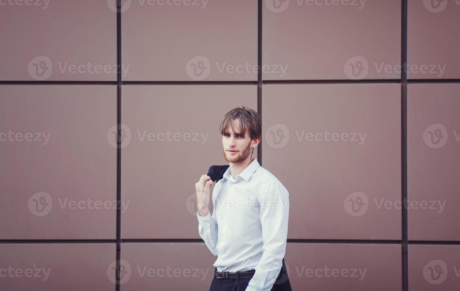 Young handsome businessman in the business center photo