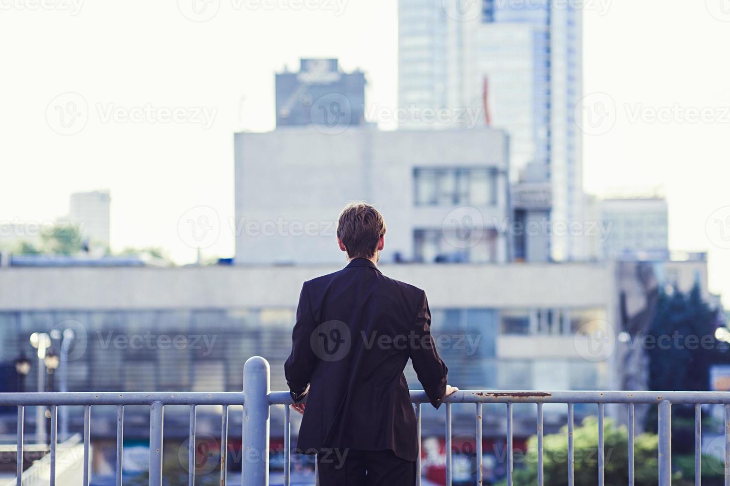 Businessman watching city view. photo