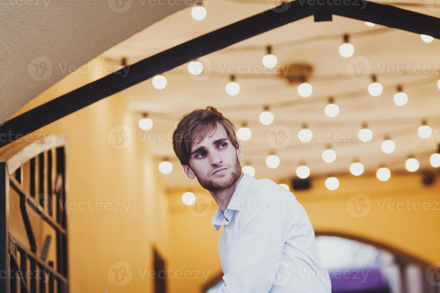 handsome young man in a white shirt photo