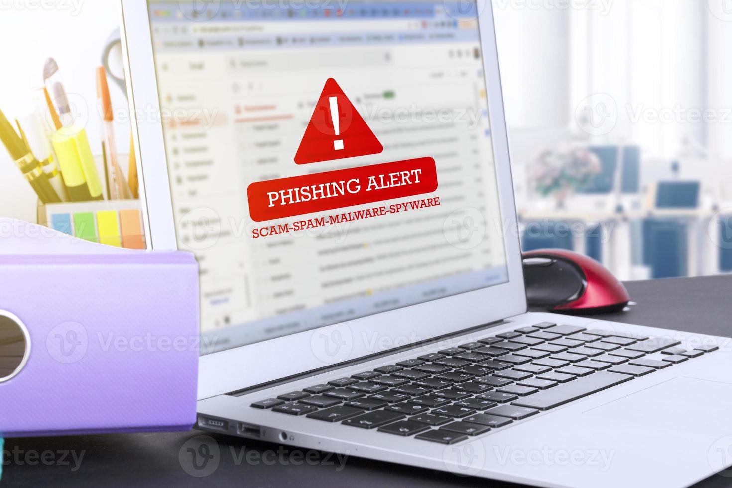 Laptop with warning text on screen PHISHING ALERT scam, spam, malware, spyware. Information poster. photo