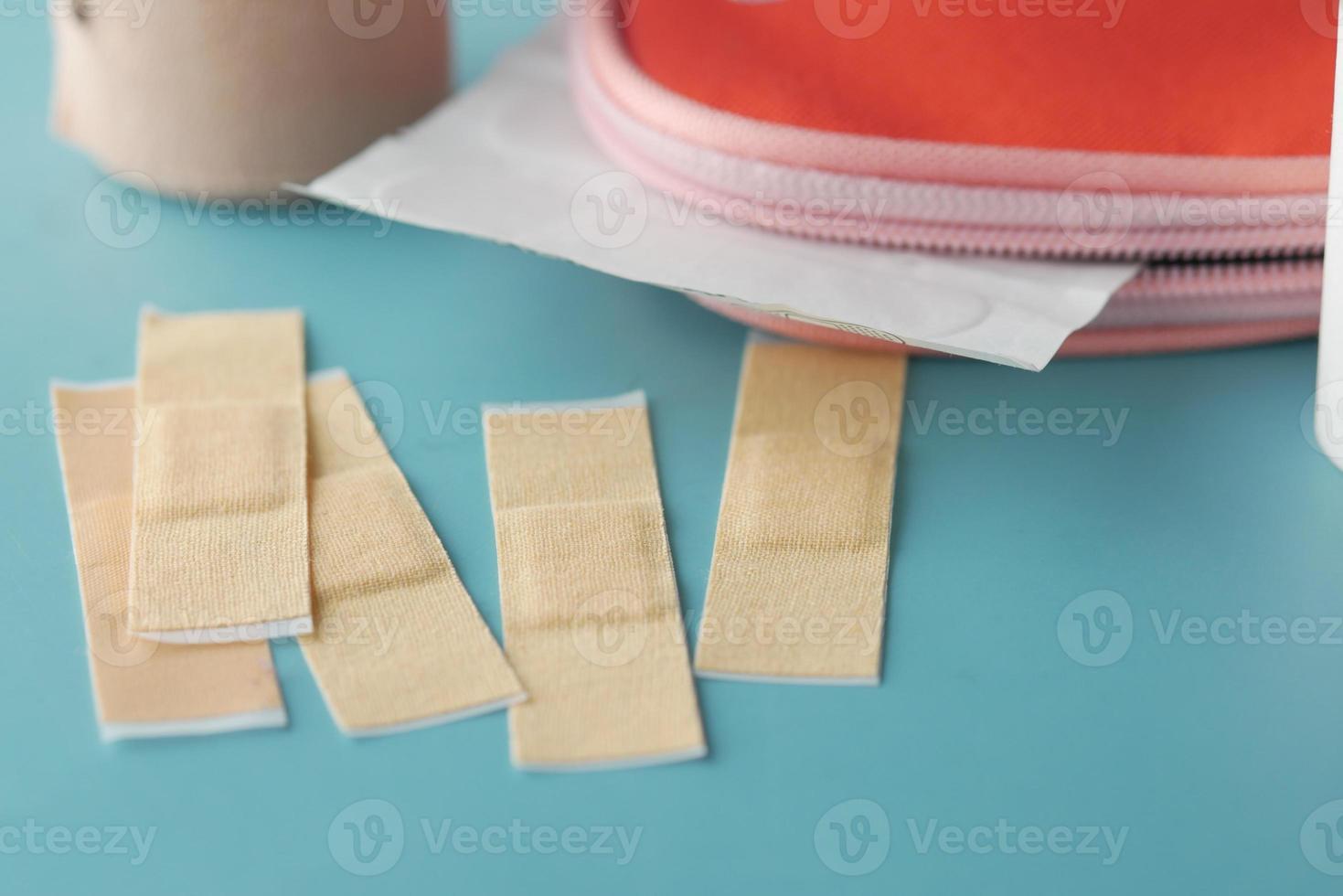 adhesive bandage and a bag on table photo