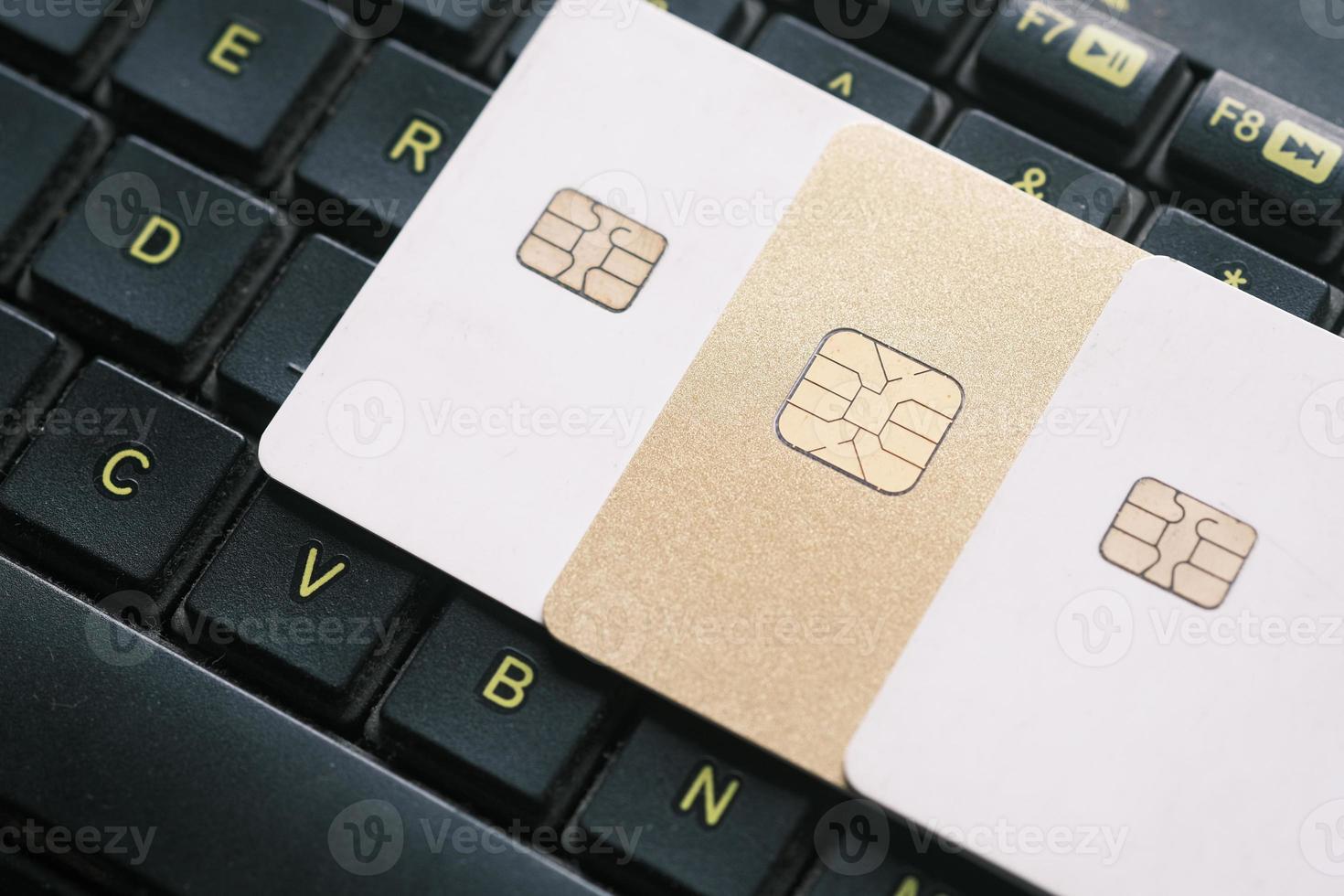 high angle view of credit cards on laptop on table photo