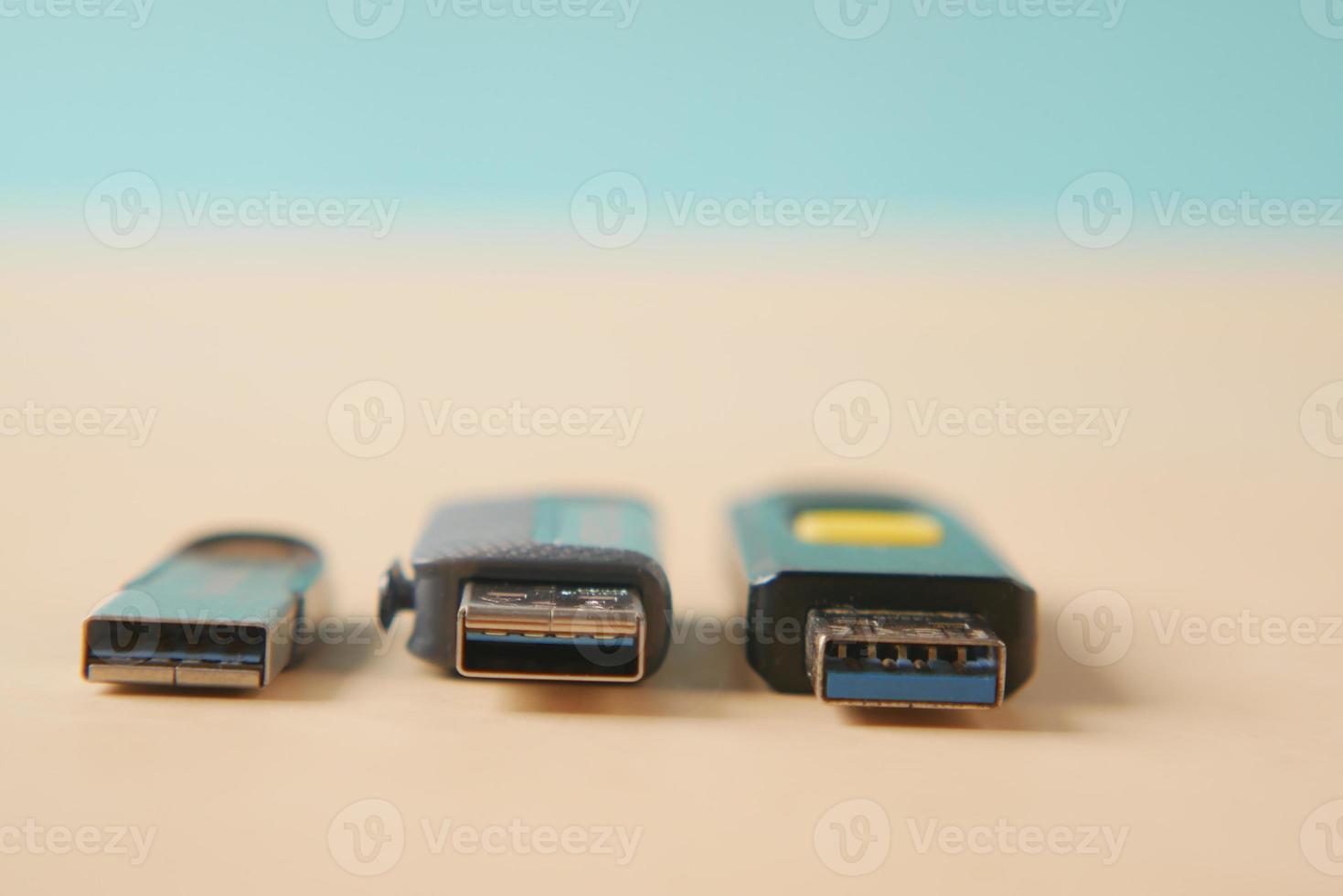 USB flash drive on blue background close up photo