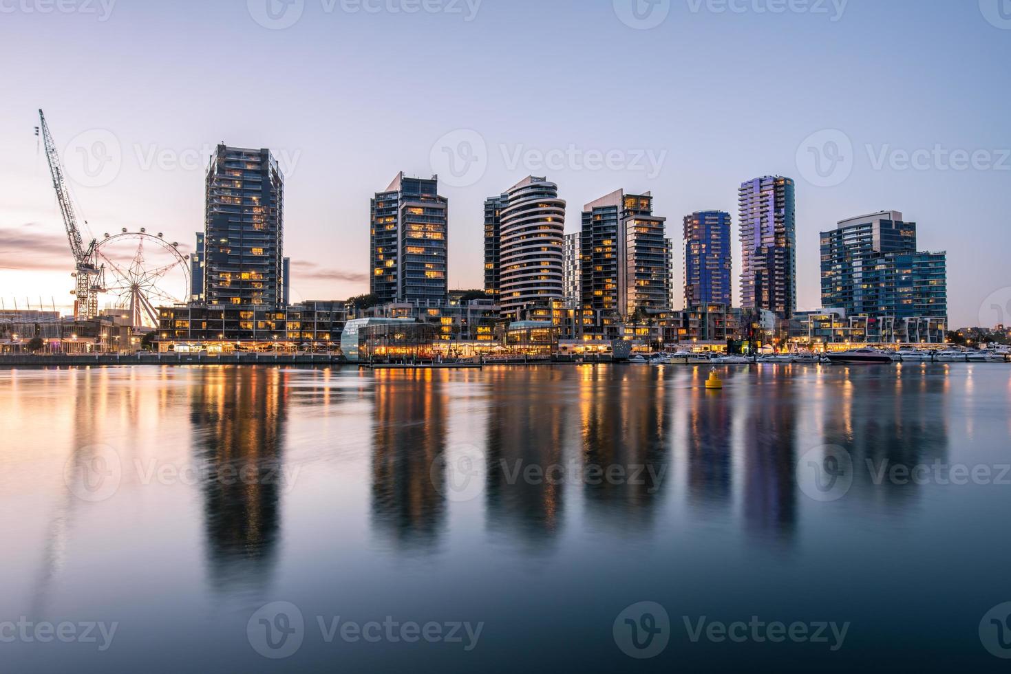The reflection of Docklands waterfront area in Melbourne at evening time, Australia. photo