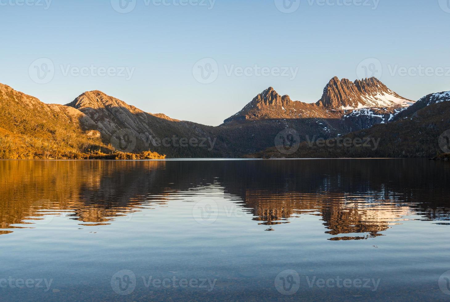 The spectacular view of Dove lake with reflection of Cradle mountain the world heritage sites of Tasmania state of Australia during the sunset. photo