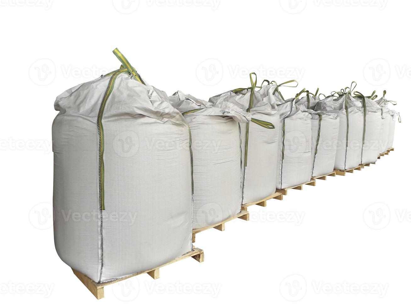 Chemical fertilizer pile Stock jumbo-bag on the White Background waiting for shipment. photo