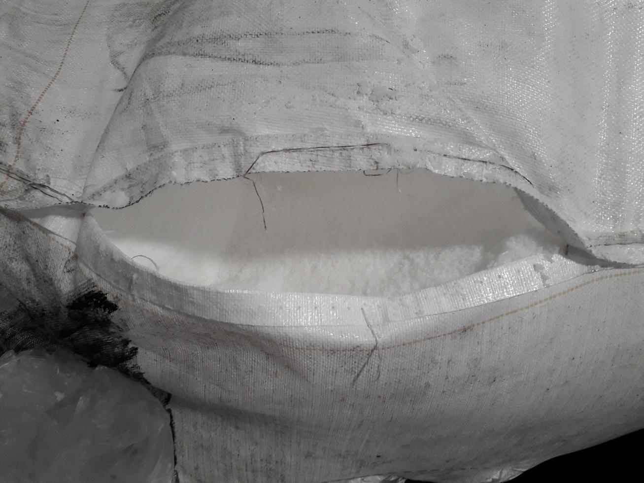 Large jumbo hemp sack White, packed with chemical fertilizer, rice, sugar, placed on a wooden pallet waiting to be delivered to the customer photo