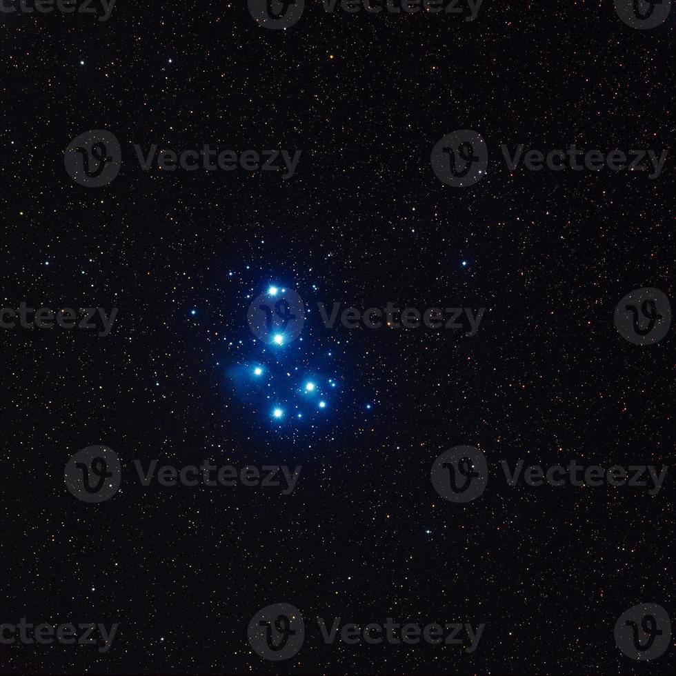 Pleiades star cluster imaged through Telescope Live's remote robotic telescopes, deep blue stars united together in dark space photo