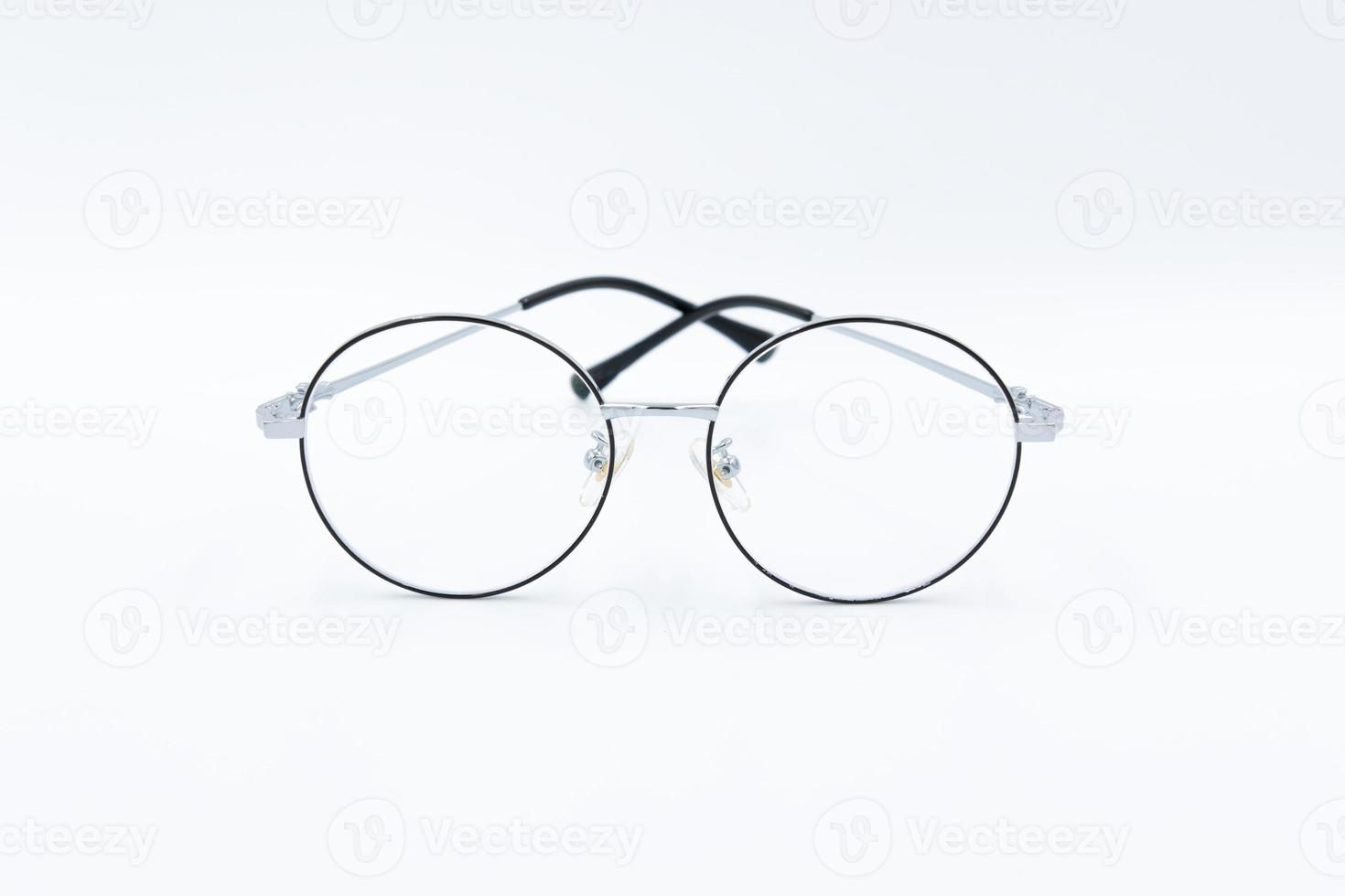 Isolated white background, Selective focus round eyeglasses with silver rim. photo