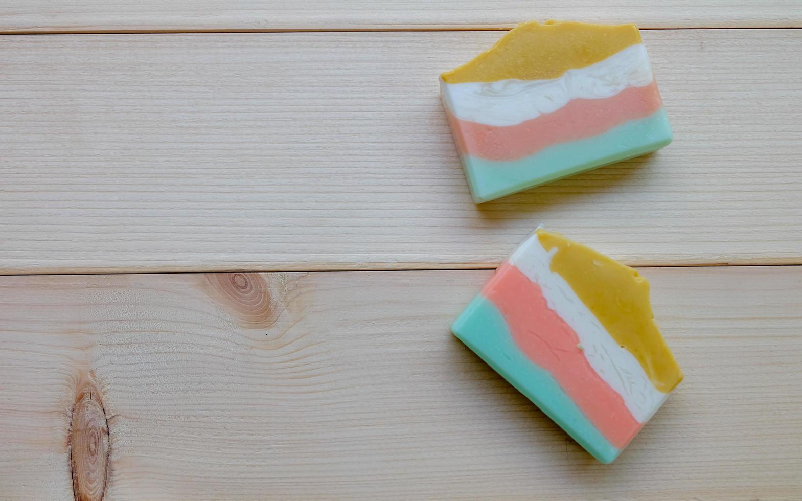 Top view and close up of Natural hand soap on wooden background photo