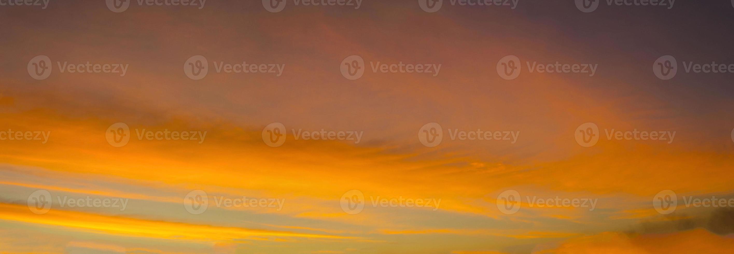 Panorama-The sky is a colorful orange-yellow horizontal line in the beautiful evening in the midst of a peaceful, warm and romantic nature in the countryside and very beautiful. photo