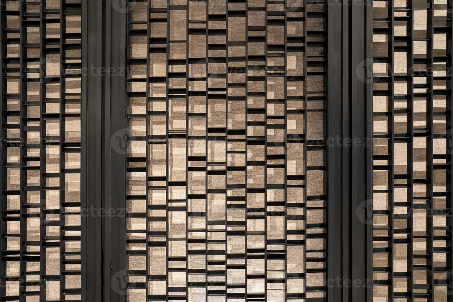 Random battens steel and pole are set in front of hotel wallpaper for backdrop and background. photo